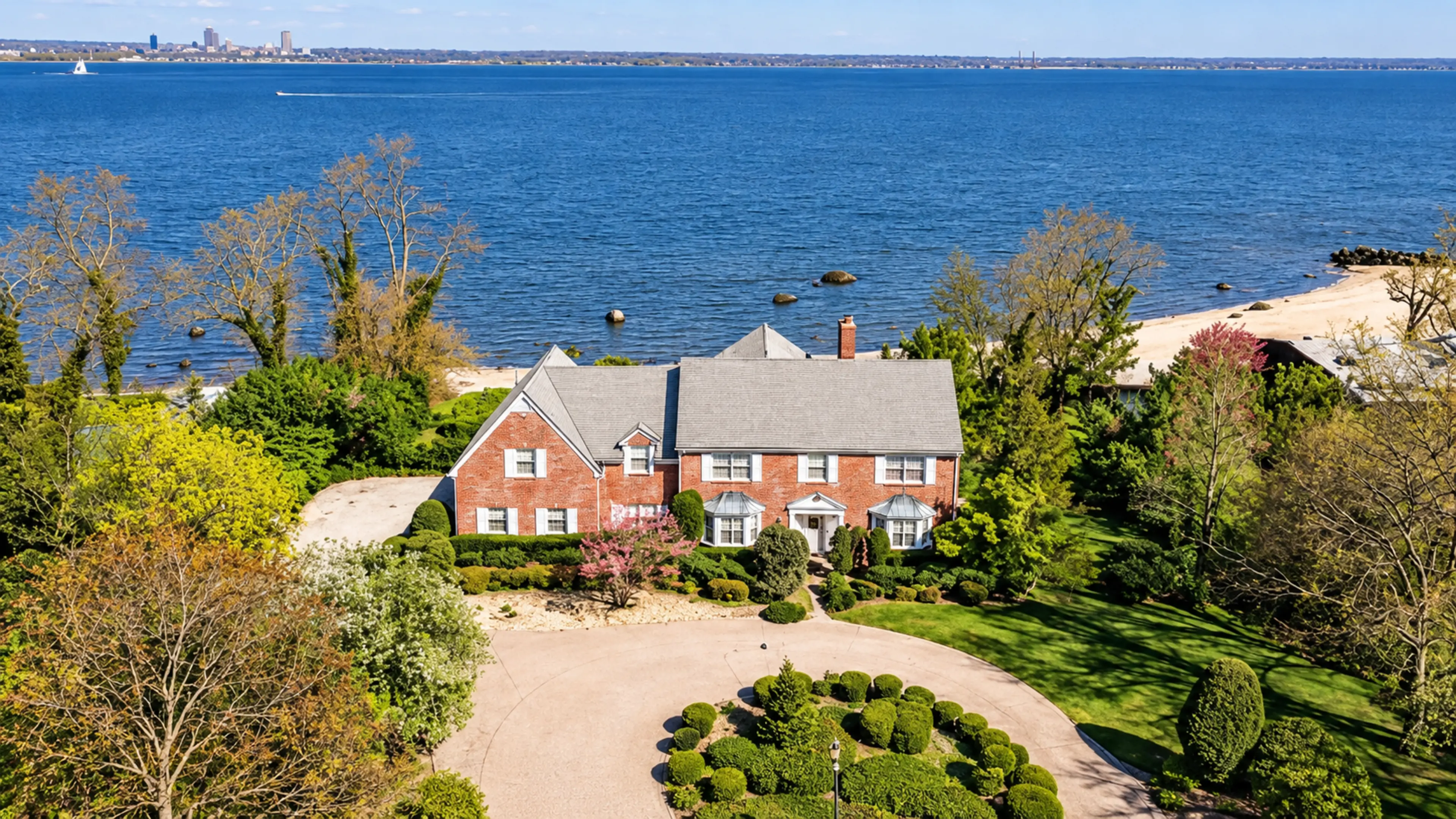 Residence by the water, with lawn and gardens
